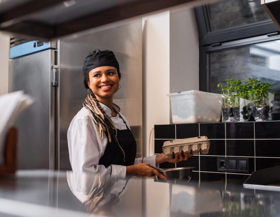 cheerful-african-american-chef-in-apron-holding-eg-2024-11-11-23-52-29-utc-scaled.jpg
